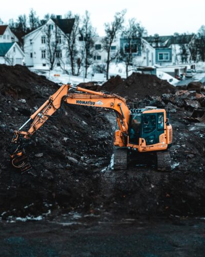 A Komatsu excavator working on a snowy construction site in Tromsø, Norway.