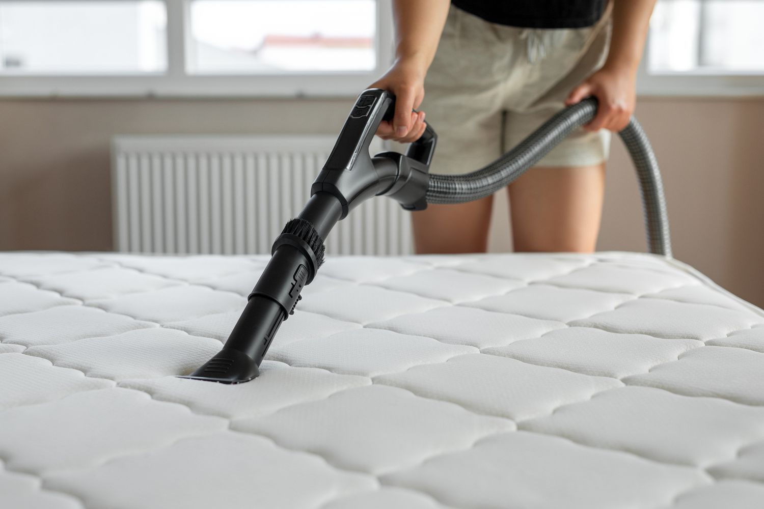 Grab your vacuum cleaner and run it over the mattress to remove dust and other debris